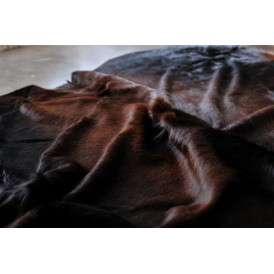 Charline Handmade Cowhide Normand Area Rug