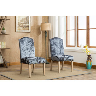 Go to store & view more images House of Hampton Wokefield Velvet Caen Nail Head Urban Ice Fabric Padded Parson Upholstered Dining Chair