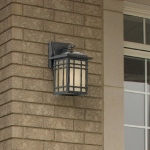 Go to store & view more images Woodard Rustic 1-Light Linen Glass Outdoor Wall Lantern by Three Posts