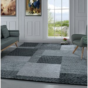 Harrill Geometric Black Area Rug