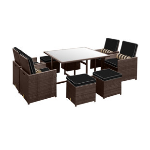 Stella II Patio Rattan 9 Piece Dining Set With Cushions And Cylinder Toss Pillows by Solis Patio Coupon