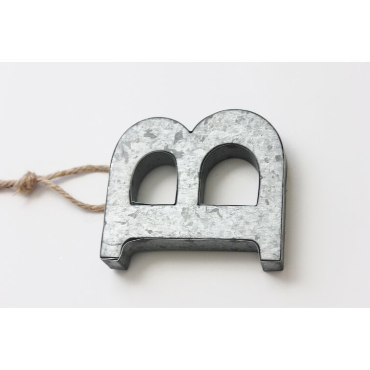Small metal letter &