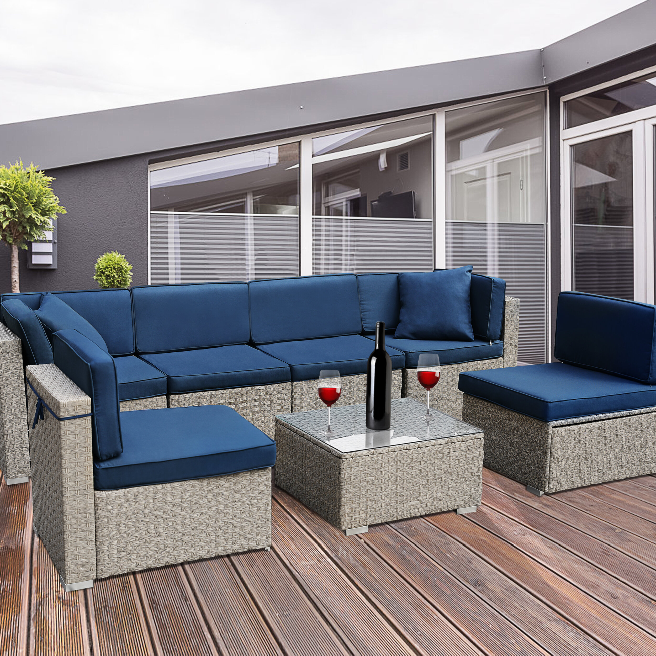 7 piece rattan sectional seating group with cushions