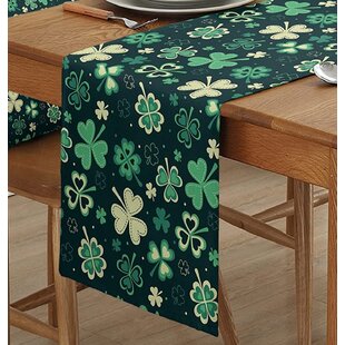 Tan and blues table topper with green xmas package on reverse washable