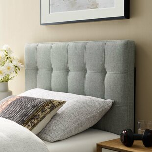 bedroom with grey upholstered headboard
