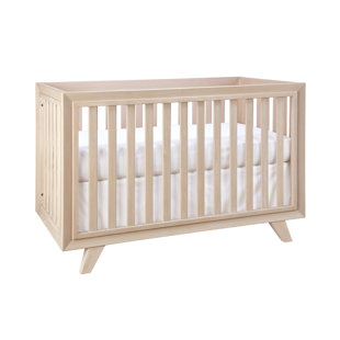 white and timber cot