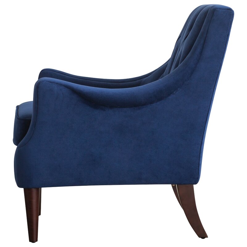 blue tufted armchair