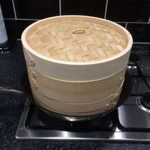 bamboo steamer over pot