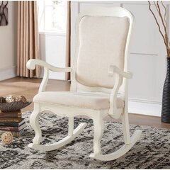 white upholstered rocking chair