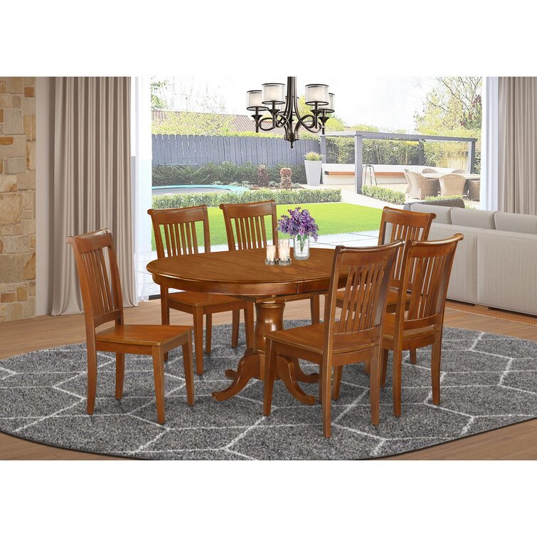 solid oak oval dining table and chairs