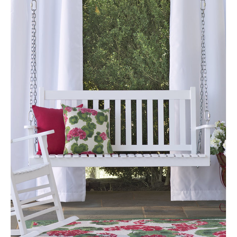 white wooden porch swing