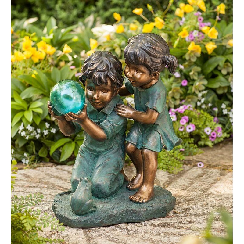 Children with Solar Ball Statue