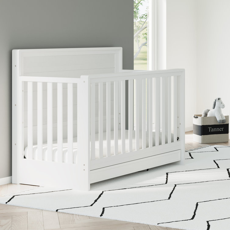 white cot with storage