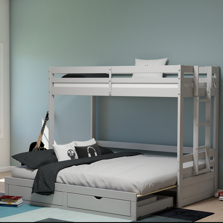bunk bed with cot at bottom