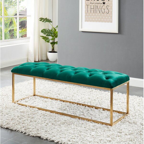 green upholstered bench