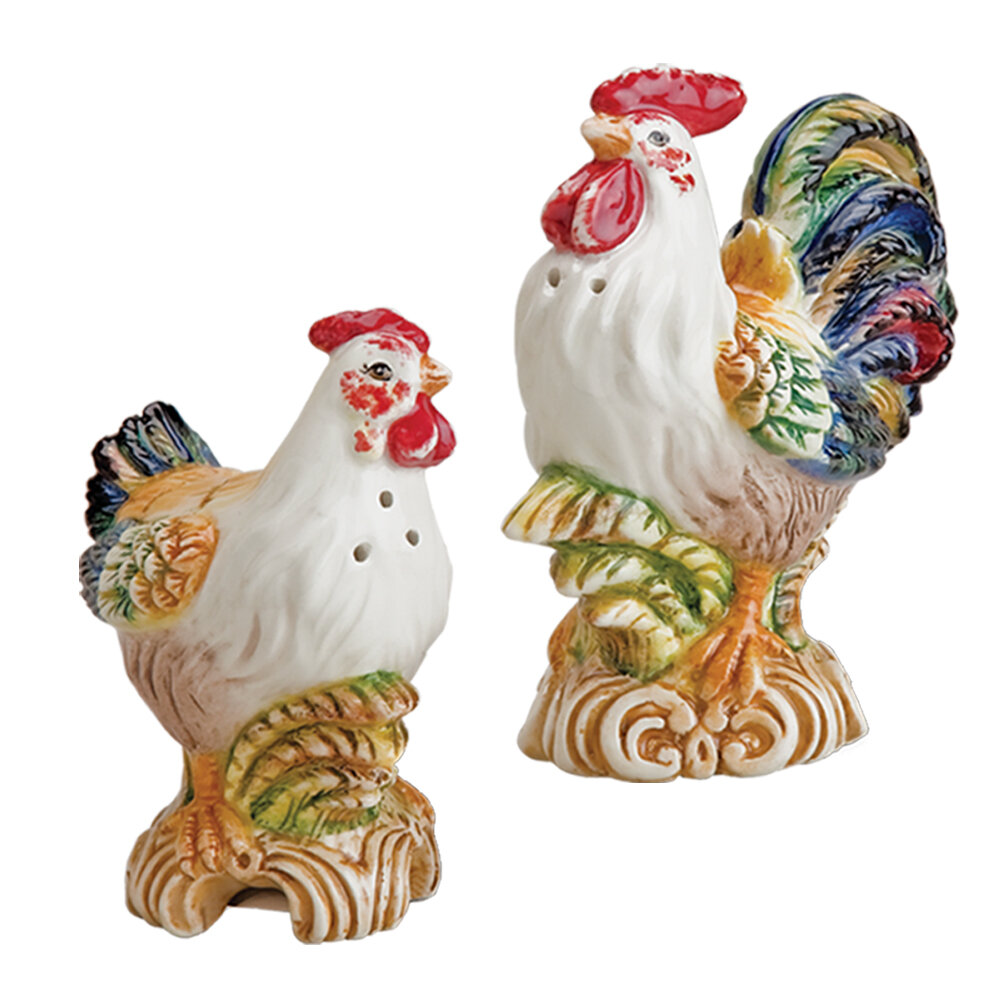 In their off white and colorful teal feathers the rooster pepper shaker and...
