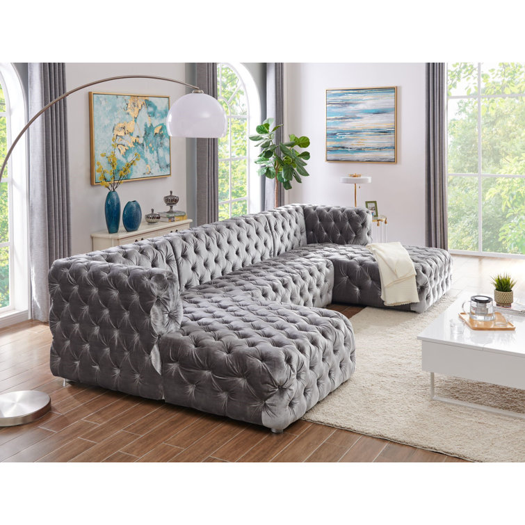 Velvet tufted sofa with chaise