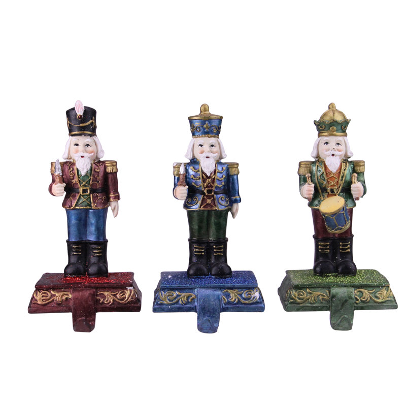The Holiday Aisle 3 Piece Glittered Nutcracker Stocking Holder Set