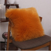 orange furry pillow