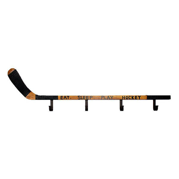 hanging hockey sticks on wall