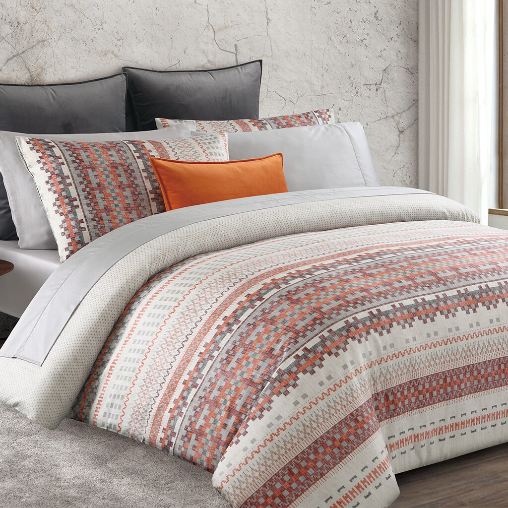 gray and orange duvet