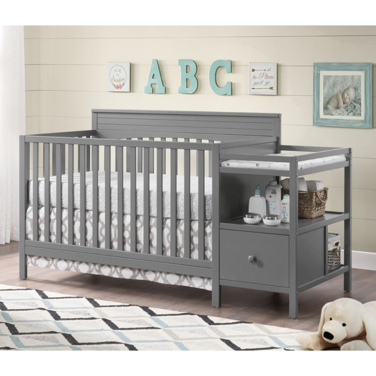 changing table next to crib