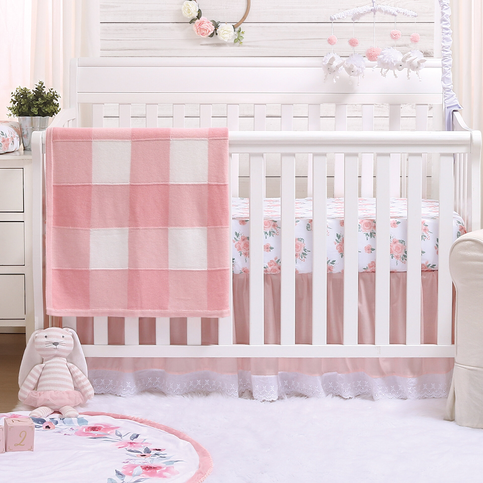 pink and white crib