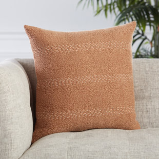 orange and beige pillows
