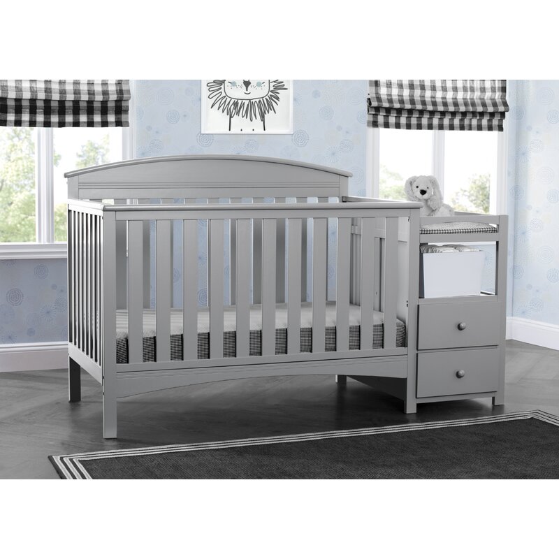 grey crib with changing table