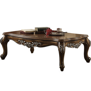 Go to store & view more images Jayla Intricately Carved Wooden Coffee Table by Astoria Grand