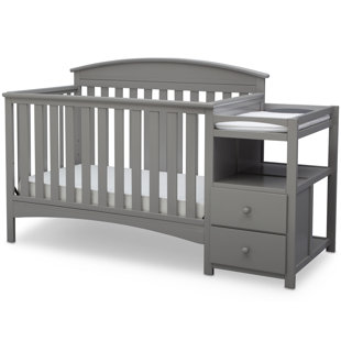 dark brown crib with changing table