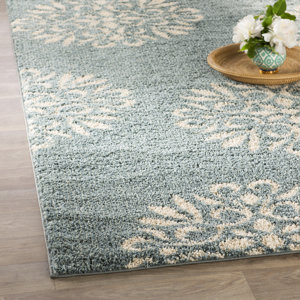 Cowden Exploded Medallions Woven Bay Blue Area Rug