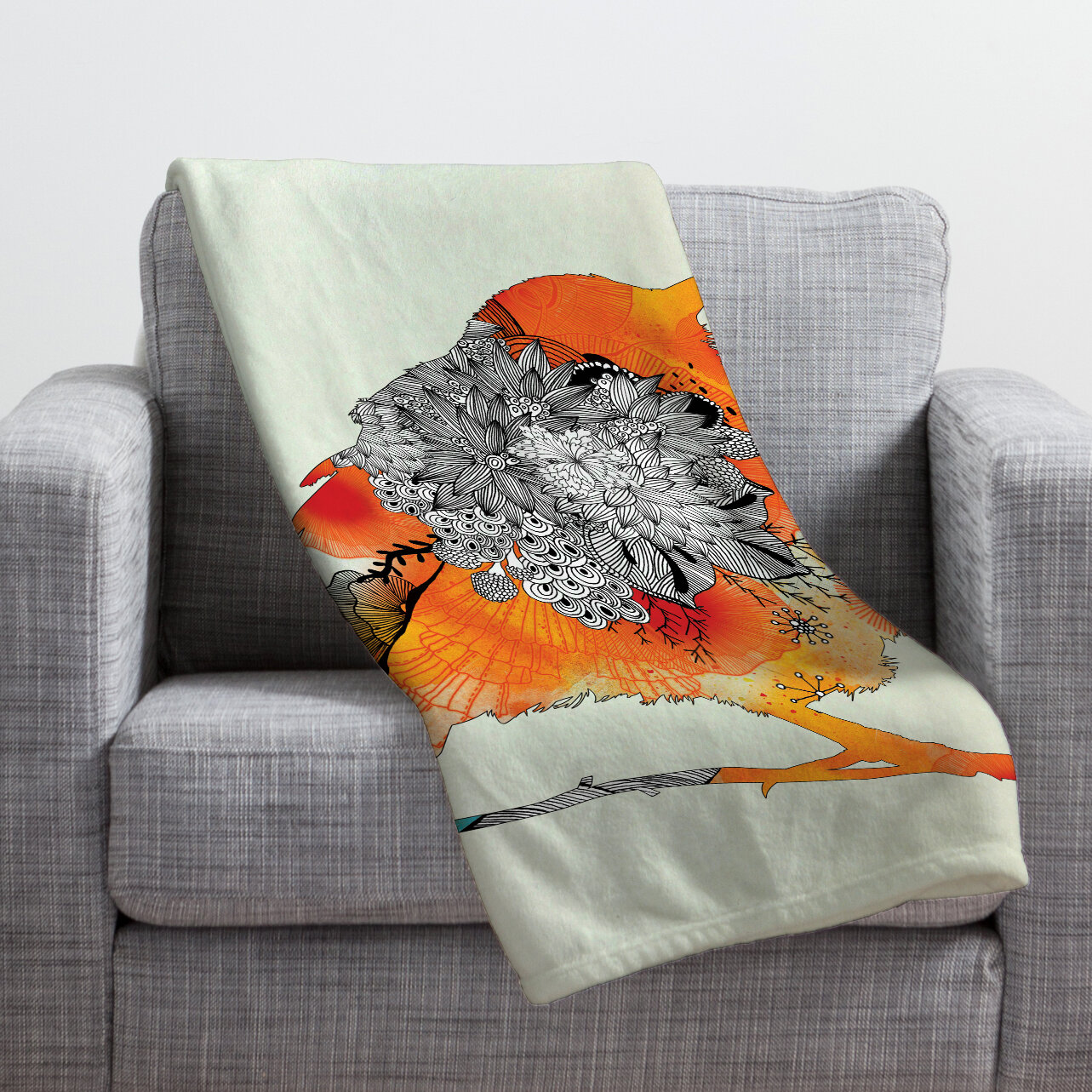 orange throw blanket and pillows