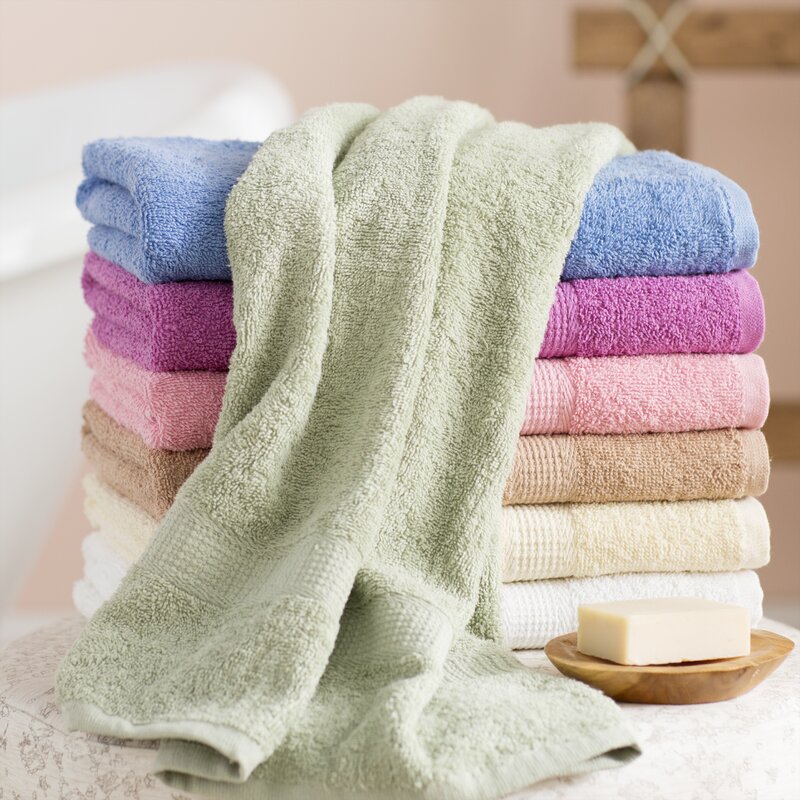 brown and green bath towels