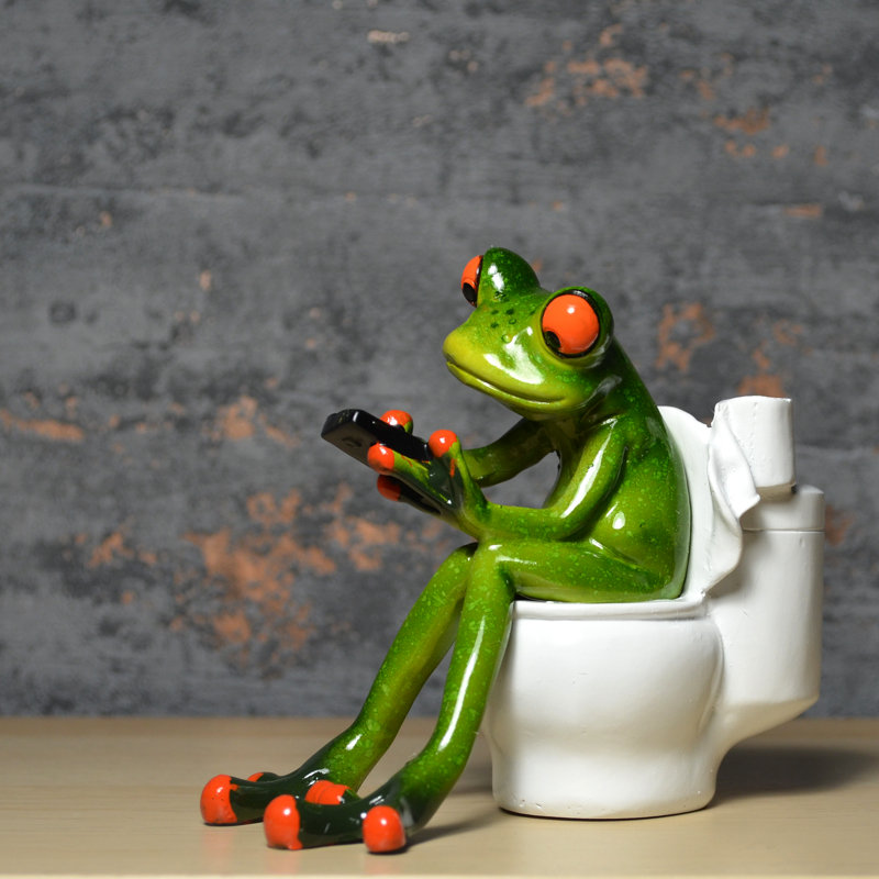Happy Larry Figur Frosch mit Humor auf der Toilette