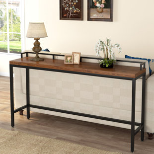 tall narrow table behind couch