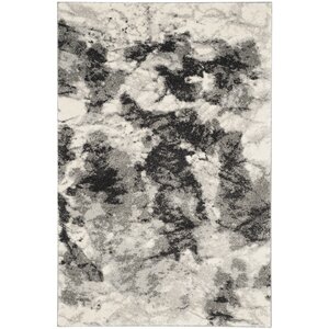 Bussiere Ivory / Gray Area Rug