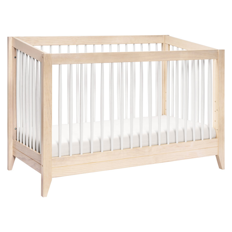 white crib with natural wood