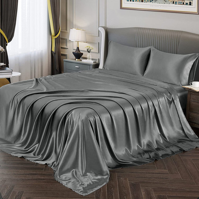 grey bed sheets and pillowcases