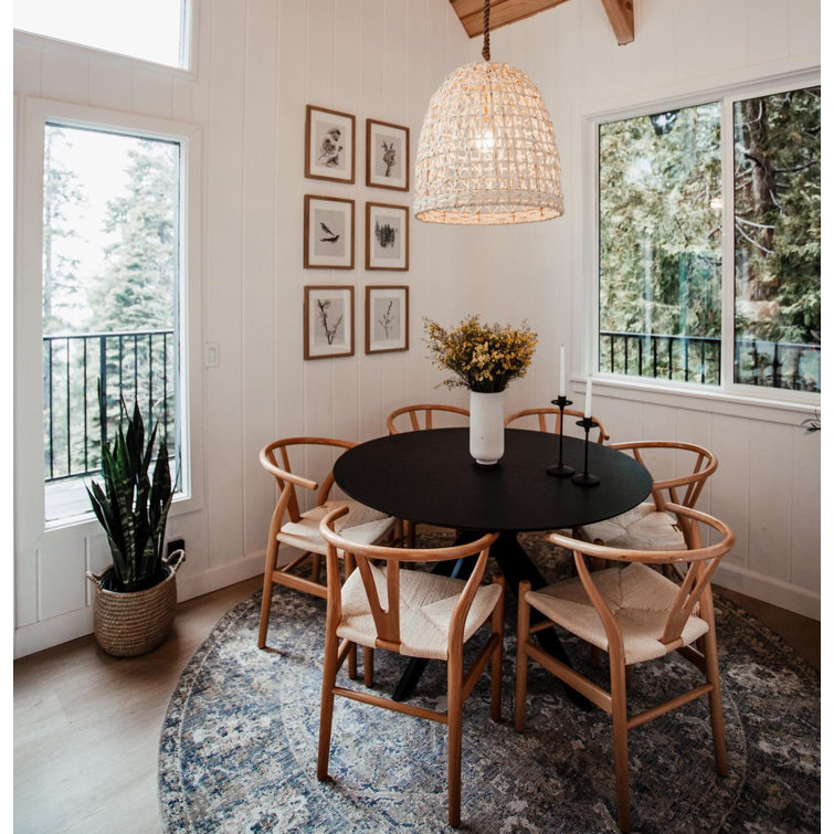 round dining table with wishbone chairs