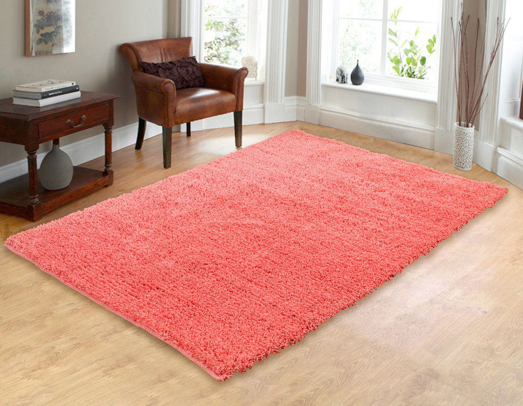 Hand woven shag coral area rug