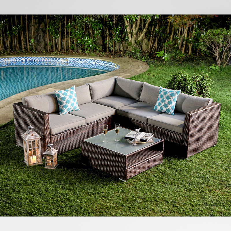 Wrought Studio Newagen 4 Piece Outdoor Furniture Set Mottlewood Brown Wicker Sofa W Warm Gray Cushions Glass Coffee Table 2 Teal Pillows Incl Waterproof Cover Reviews Wayfair