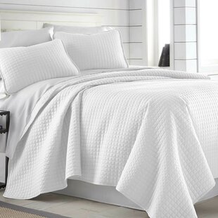 white bed coverlet