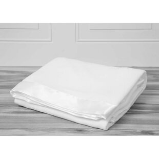 white blanket with satin trim