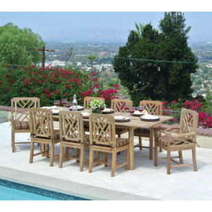 Go to store & view more images Lorenzo Outdoor Teak 9 Piece Dining Set with Cushion by Longshore Tides