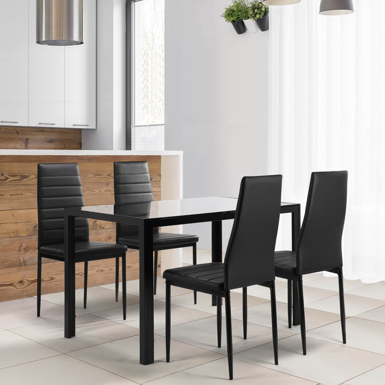 Latitude Run 5 Pieces Dining Table Set With 1 Tempered Glass Dining Table 4 Faux Leather Chairs Wayfair