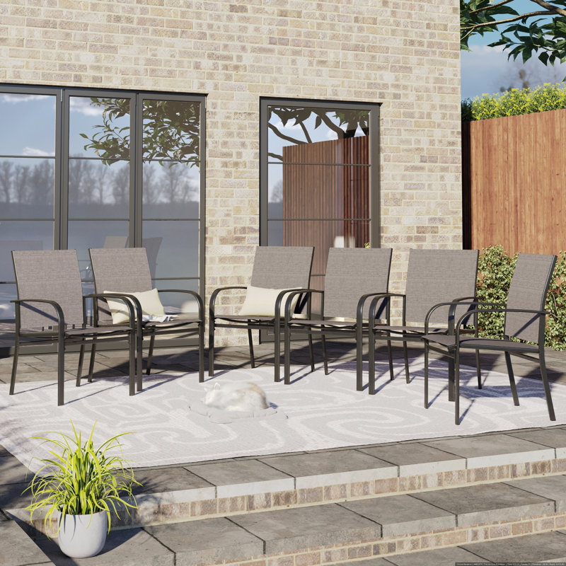Argyri Patio Dining Armchair Cushion Color: Brown