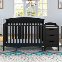 black crib with changing table