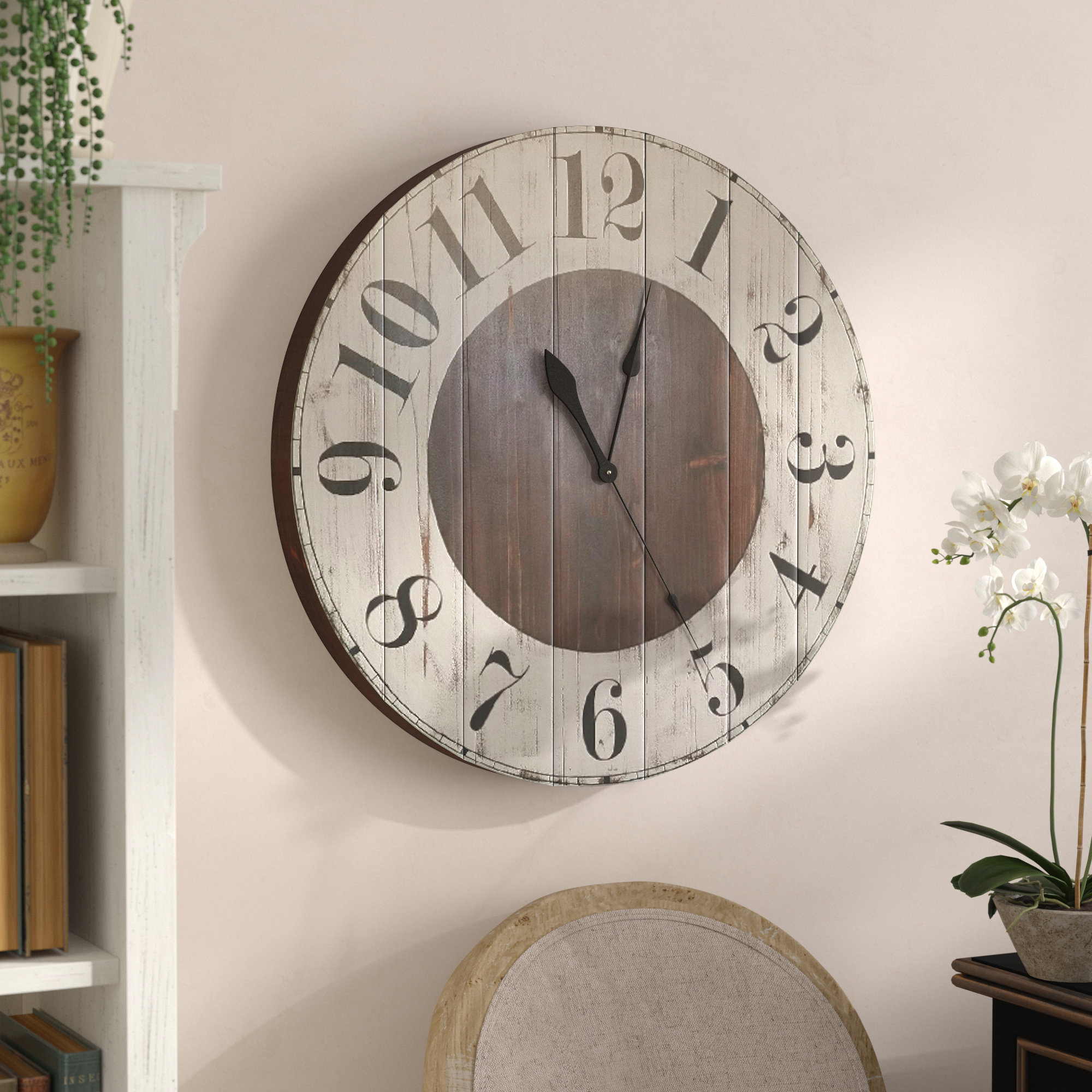 large wall clock with picture frames