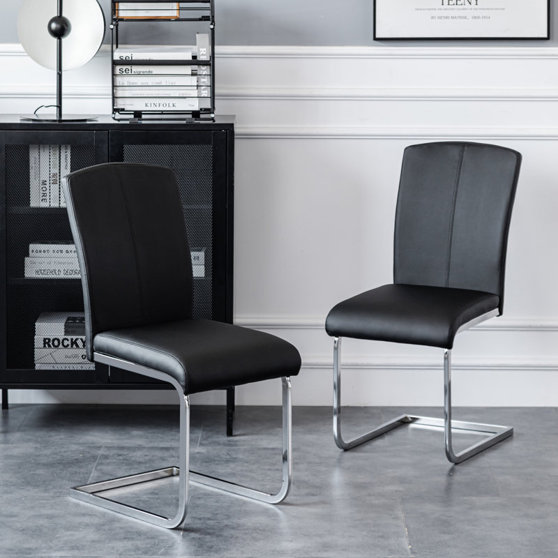 Chelsye Modern Industrial Design High Back Faux Leather Accent Dining Chairs Upholstery Color: Black